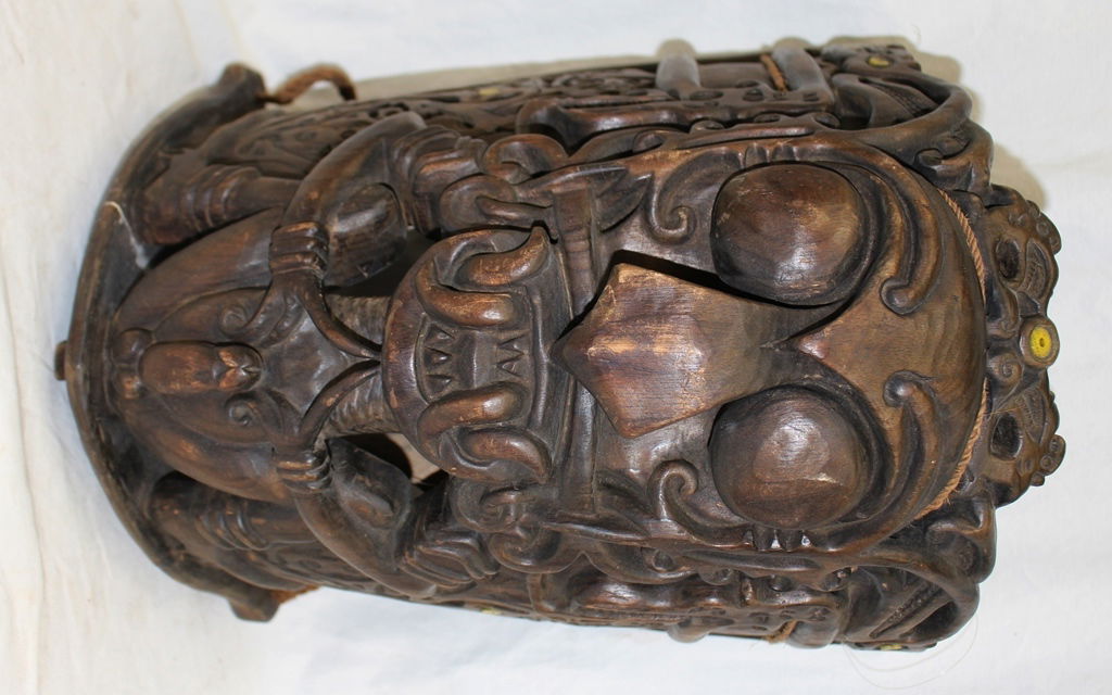 Southeast Asia Carved Wood Baby Carrier for Male Babies: Heavily carved wooden baby carrier that measures 18" tall, 12" wide and 10" deep. Very detailed carving with large male organs on front indicating this would have been carved for male babies. Mid 20th