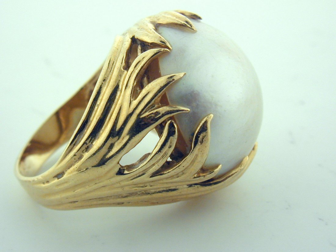 Mabe Pearl Ring 14 Kt Solid Gold with Huge 18 mm Pearl: Size 6.5 Flower Motif Marked 14 Kt Gold Weighs 12.3 gr Gold Petals surround the luminous Pearl