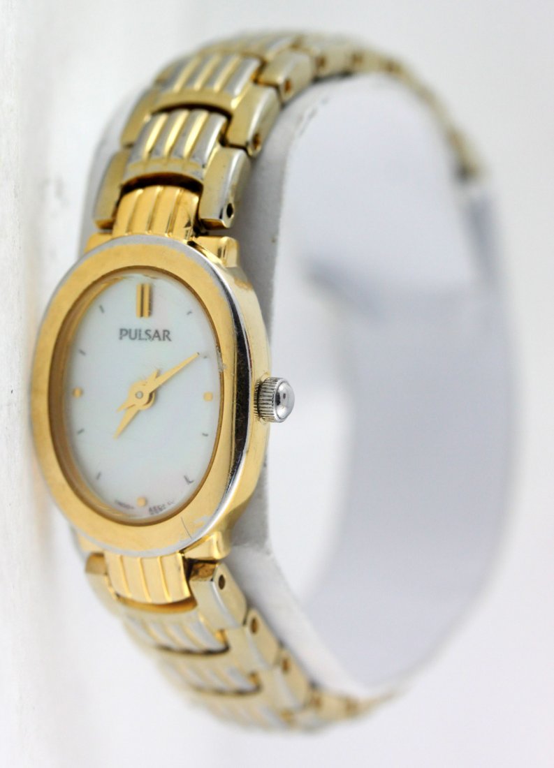 Pulsar Gold Tone Oval Dial Stainless Steel Ladies Watch: Wrist size 6" Face measures 17mm left to right Stainless steel