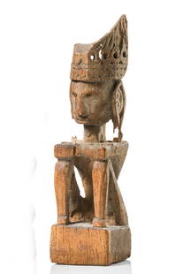 Seated ancestor figure "iene" - Indonesia - Moluccas -: wood, greyish brown patina, seated in typical posture with knees drawn up to the chest and arms folded across the knees, wing-shaped headdress and ear ornament in openwork design, dam., insect caused