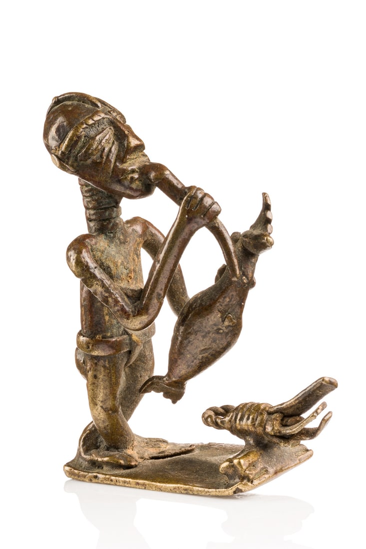 Gold weight: man with flute - Ghana, Akan (1 of 6)