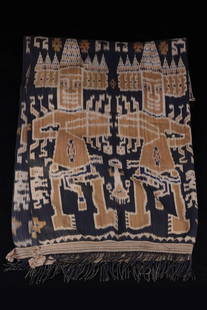 Ikat - Indonesia: cotton, two cloth width, dark blue fond, ornamental and figural motifs in beige and white, fringes on either end, faded colours in some areasM: 220 cm x 100 cmProvenance:English Private