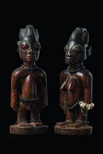 Male/female pair of twin figures "ere ibeji" - Nigeria,: wood, reddish brown patina, black paint, pigments, metal tag eyes (missing for the male figure), adorned with strings of miniature glass beads and coconut discs, large eyes with grooved eyelashes, tri