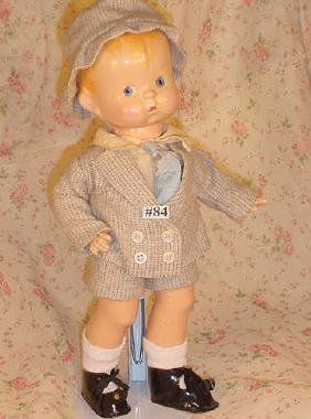 14" Effanbee Skippy: 14" vintage jointed composition Effanbee Skippy, molded hair and painted eyes, clothing possibly original, replaced shoes. Hair repainted, some cracking and flaking of paint, inherent flaw right cheek