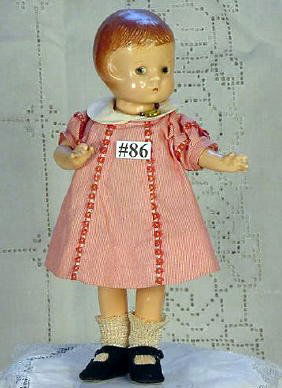 9" Effanbee Patsyette: 9" vintage jointed composition Effanbee Patsyette having molded hair, painted eyes, vintage dress possibly original, retains "Molly-'es" dress tag, shoes replaced. Paint chipping/wear along legs. Mark