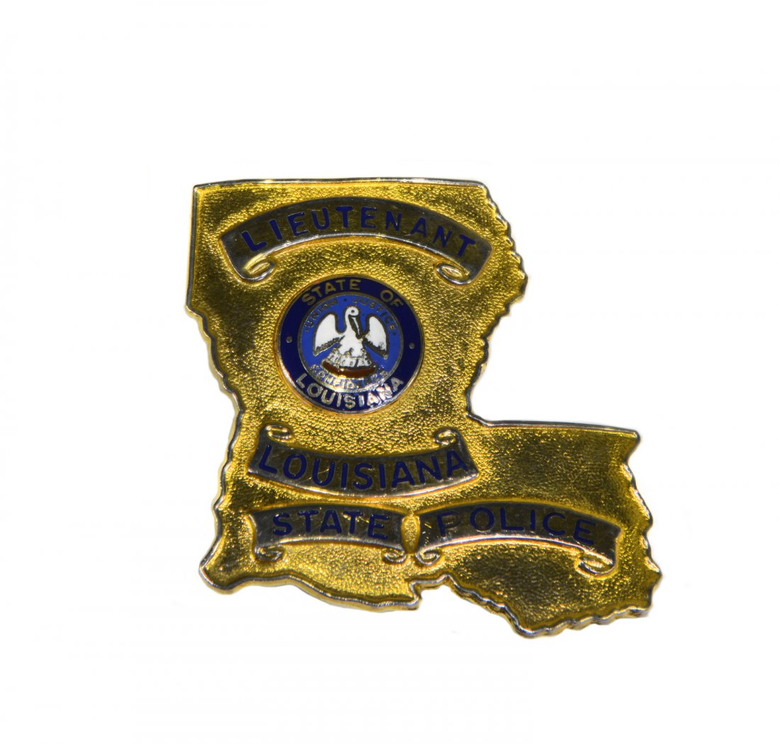 Louisiana State Trooper Badge: From the Collection of Greg Page. This honorary gold-plated and enameled Louisiana State Trooper Badge was given to Elvis by then Chief Deputy Tommy Hollingsworth, who later became Sheriff Hollingswor