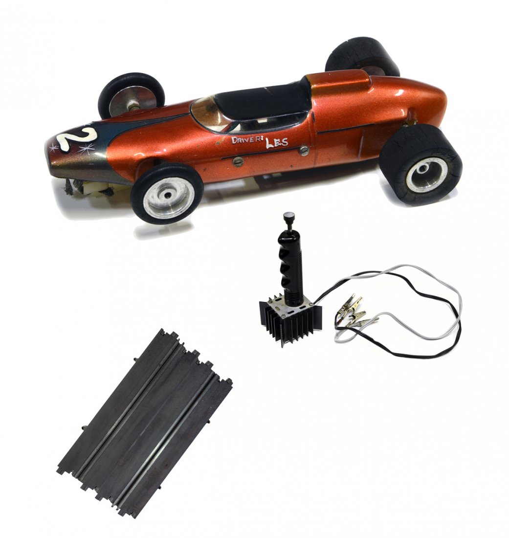 Slot Car, Controls, Track Section and Related Receipts: From the Collection of Greg Page. In 1965, Priscilla gave Elvis a small slot car track as a Christmas gift. He became so infatuated with the hobby that he purchased a larger track and supplies in the