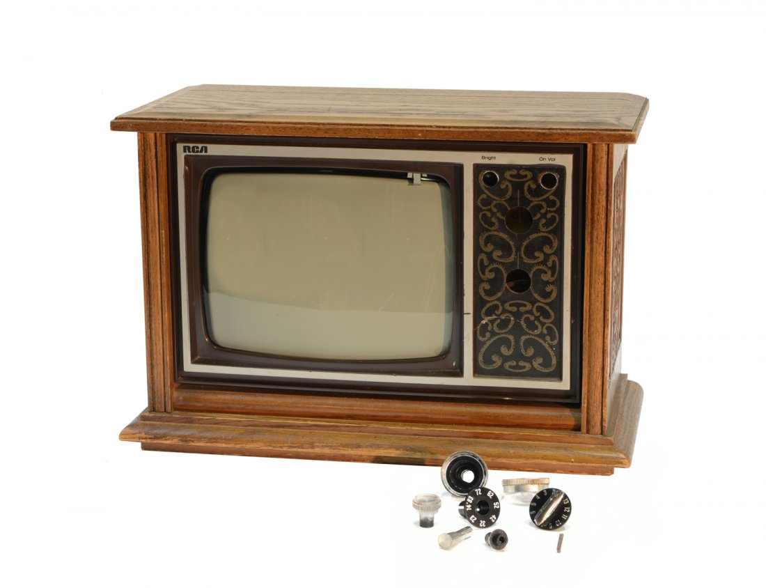 RCA TV from Graceland: From the Collection of Greg Page. This RCA TV, model AP100L with 9-inch screen and oak case, was located in the kitchen at Graceland (please note that the dials need repair). Accompanying this TV is a