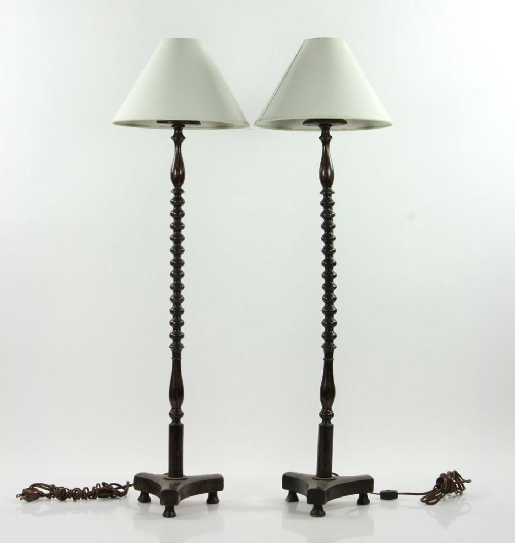 Pair of Wig Stand Lamps: Pair of English wig stands, ebonized wood, converted to lamps, tripartite base and bobbin turned standard, disk and socket at top, circa 1880, 31" high.