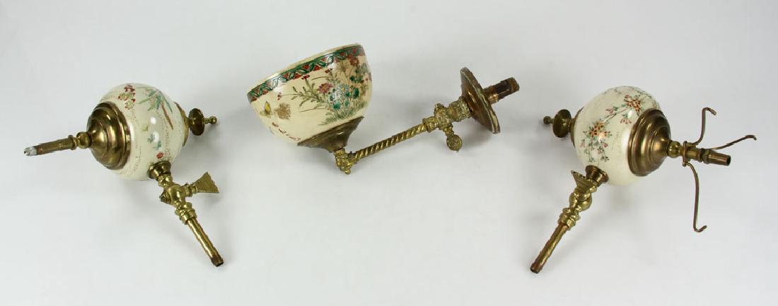 Three Satsuma Gas Lights: Three gas light fixtures, brass with satsuma fonts, circa 1900, largest 11" high. Provenance: from a Massachusetts estate.