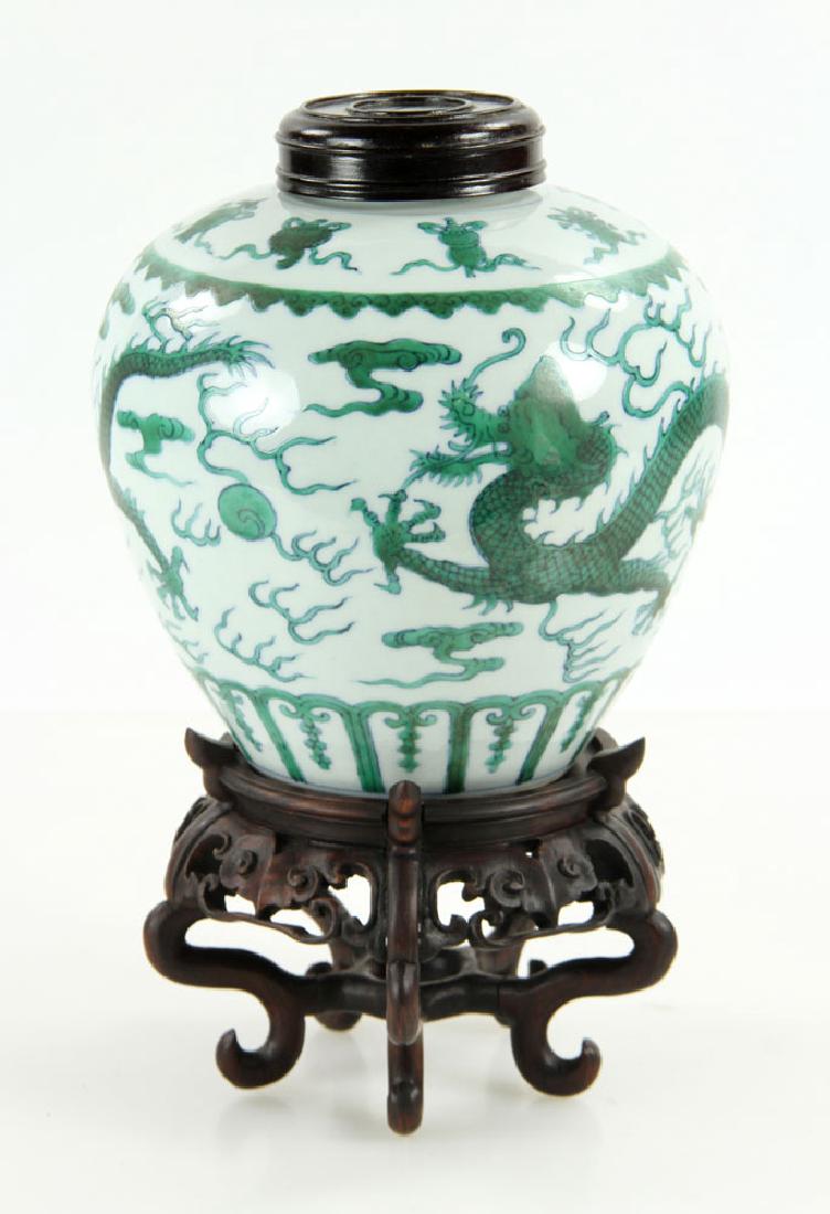 Chinese Qianlong Famille Verte Porcelain Jar: Qianlong famille verte porcelain jar, Chinese Qing Dynasty, decorated with green flying dragon and Buddhist Eight Treasure symbols on shoulder, plantain leaf pattern around bottom rim, Qing Qianlong m
