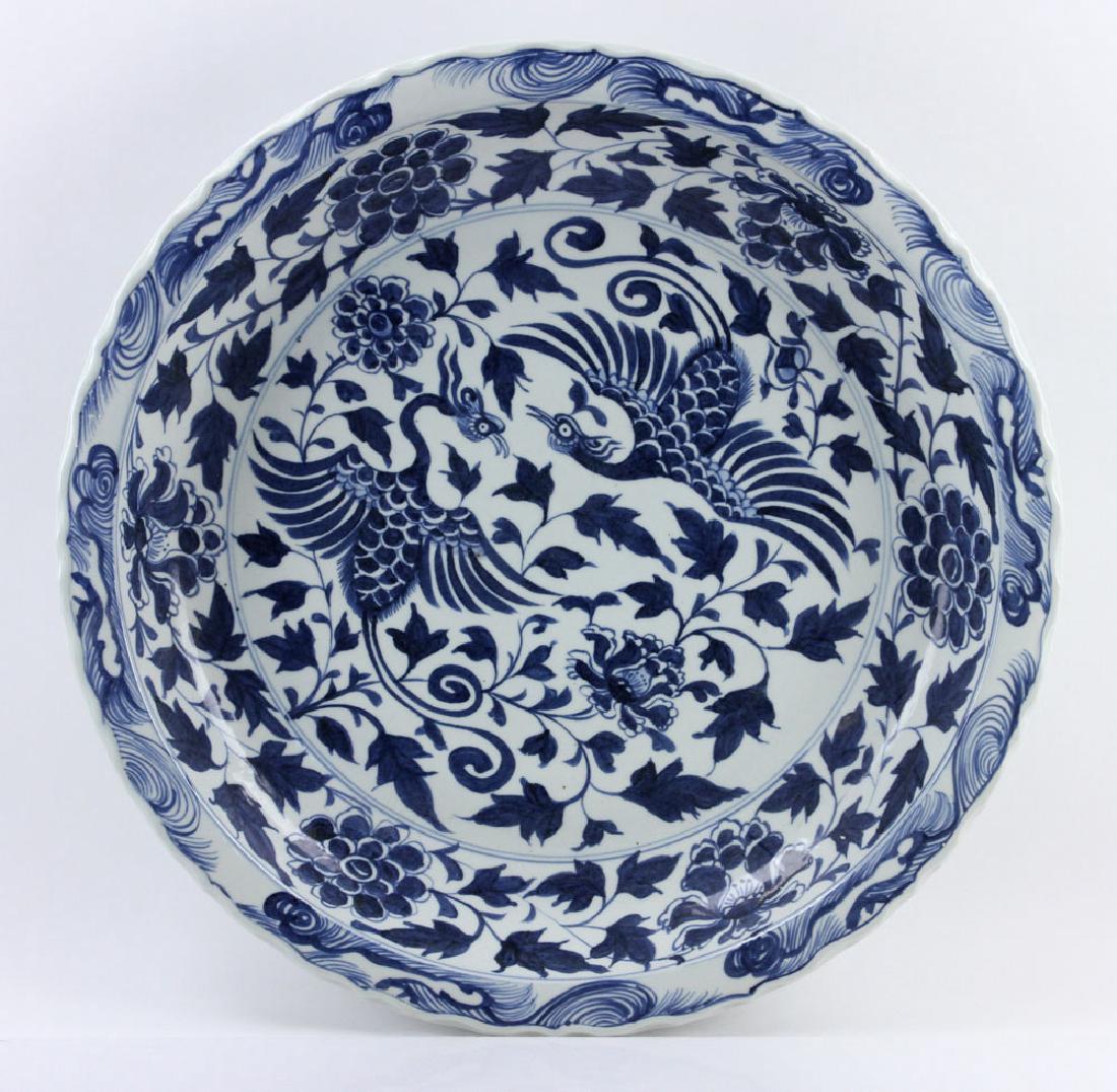 Antique Ming Dynasty Charger: Antique Chinese Ming Dynasty charger, porcelain, decorated in blue and white glaze, 23" diameter.