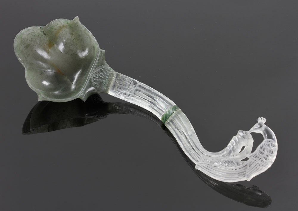 Mughal Jade And Crystal Ladle: Watch This LotCarved Mughal jade and rock crystal spoon or ladle, with peacock motif decoration to handle, 8" l. Provenance: From a Houston, Texas collection.