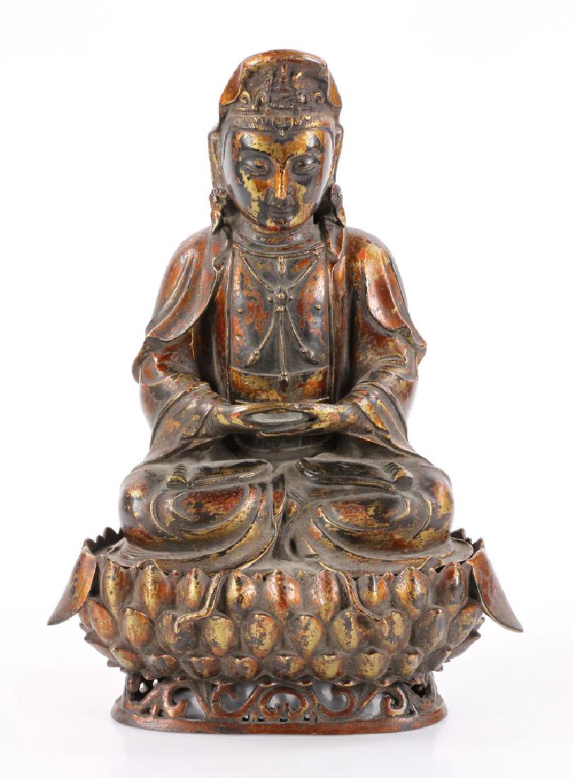 Chinese Antique Bronze Guanyin: Chinese antique bronze Guanyin, having delicate facial expression, wearing jewelry, seated in lotus position on lotus base, 14 1/2" h.