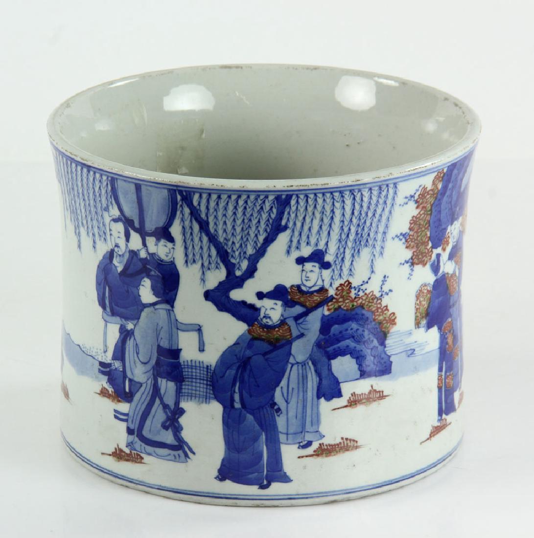 Chinese Blue and White Porcelain Brush Pot: Chinese blue and white porcelain brush pot, 20th century, with under glazed red copper design, decorated with scholar relaxing in garden, Kangxi mark on base, 6" h x 7 1/2" w.