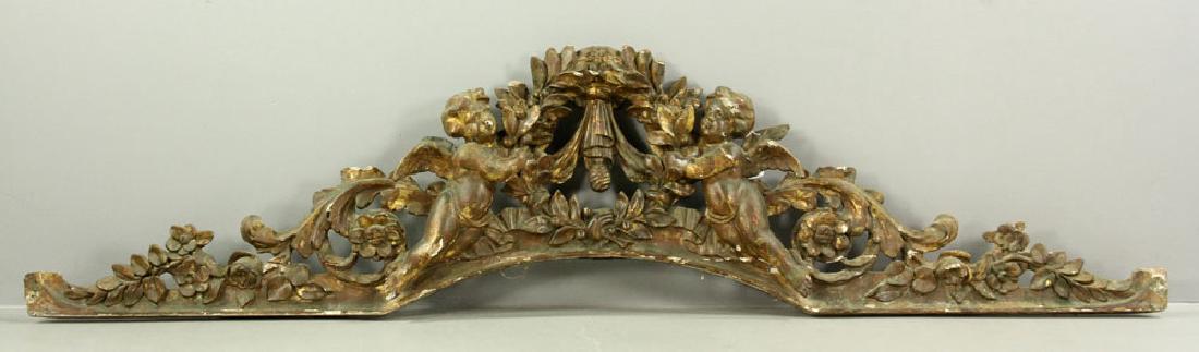 Carved and Gilded Arch with Cherubs: Carved and gilded arch with cherubs, from an 18th/19th century French royal coach, 23 1/2" h x 7' 11" w. Repaired. Provenance: From a Whitinsville, Massachusetts collection.
