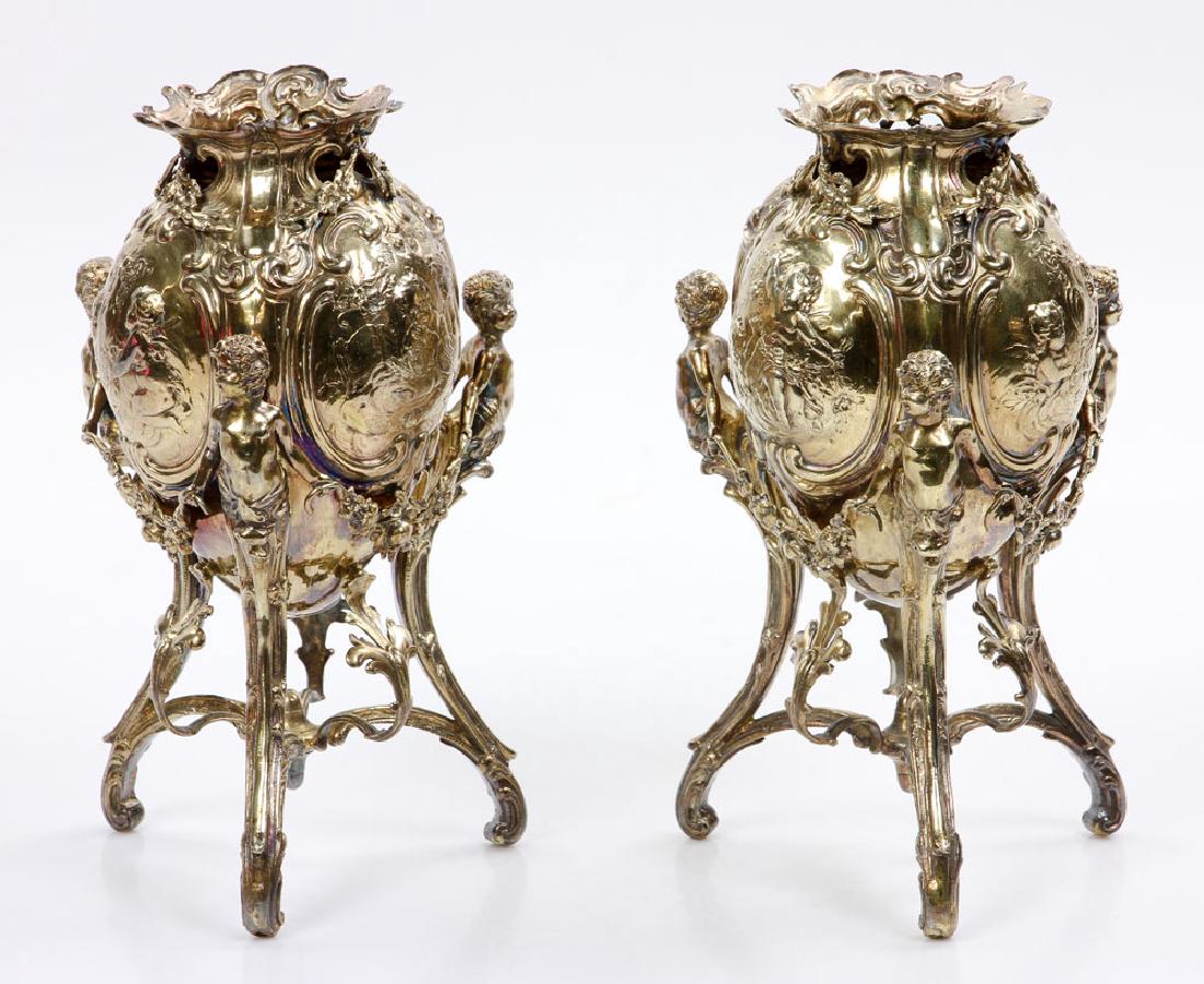 Pair of English Sterling Vases: Pair of English footed vases, sterling silver, decorated with garlands and putti, hallmarked for Chester 1801-1802, stamped F for imported ware, 7 1/2" high 4" diameter, approximately 28.9 troy ounces