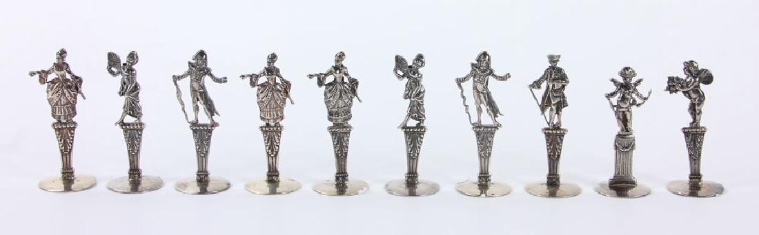 Ten Figural Silver Place Card Holders: Ten French figural place card holders, silver, hallmarked and tests silver, 2" high, approximately 2.4 troy ounces total weight. Provenance: from a Jupiter, Florida estate.