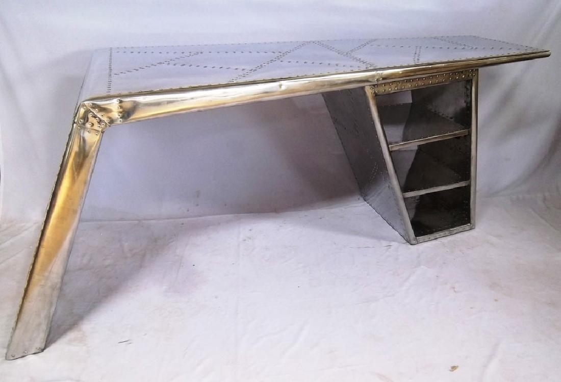Riveted Aviator Desk: Designer aviator desk, riveted aluminum reminiscent of a plane's wing, 30" high x 82" wide x 35" deep (widest).