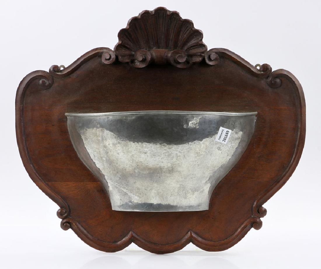 Hammered Silver Wall Sconce: Hammered silver wall sconce, with sculptured and carved wood plaque, 18" h x 19" w. Provenance: from the estate of former US Ambassador to the Congo Edmund Gullion, thence by descent from a Florida es