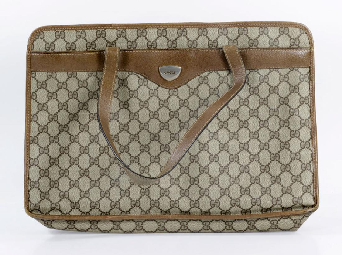 Vintage Gucci Bag: Vintage Gucci bag, circa 1973 to 1978, 20" h x 17" w. Provenance: From a Palm Beach estate.The absence of a condition report is not an implication that the lot is in perfect condition or free from imp