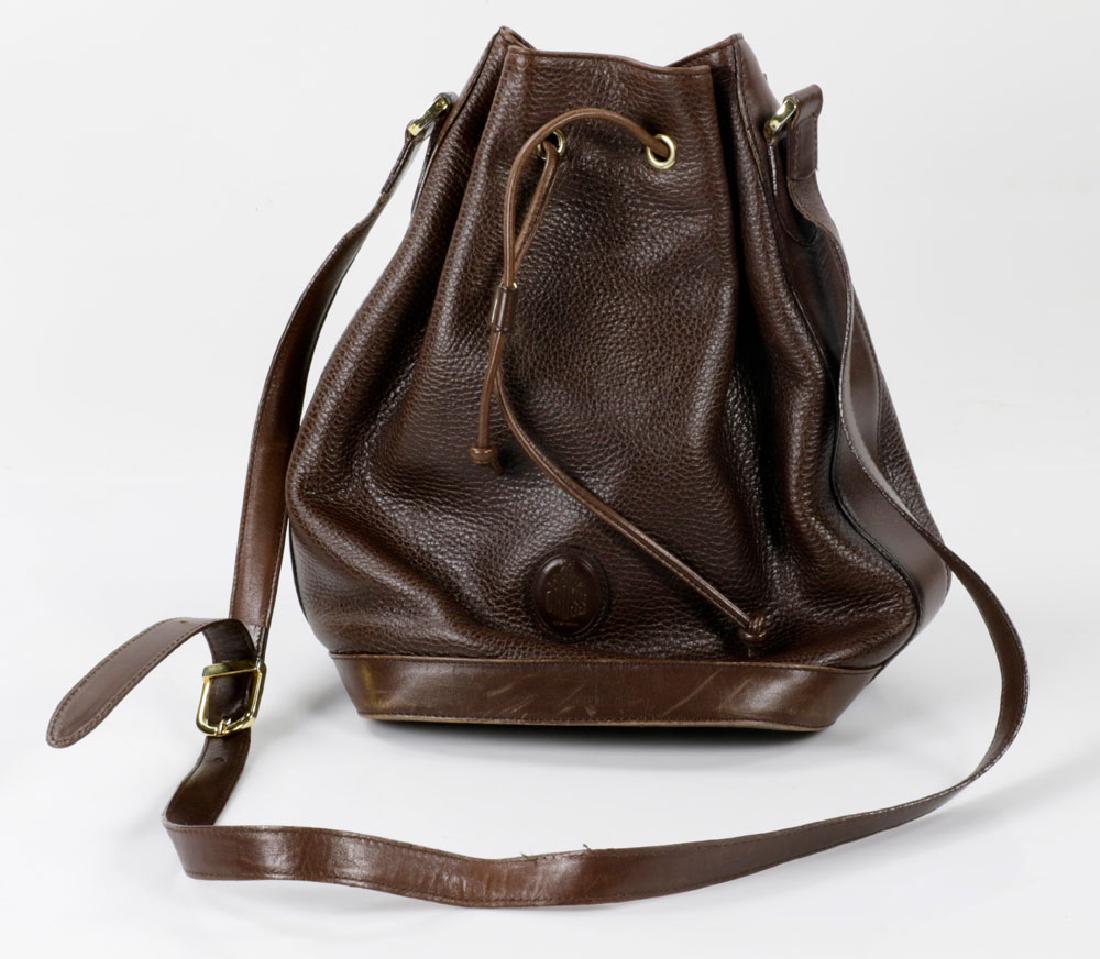 Vintage Mark Cross Leather Bag: Vintage Mark Cross brown bucket leather bag, circa 1975, 11 1/2" h x 11" w, 31" h (including strap). Provenance: From a Palm Beach estate.The absence of a condition report is not an implication that t