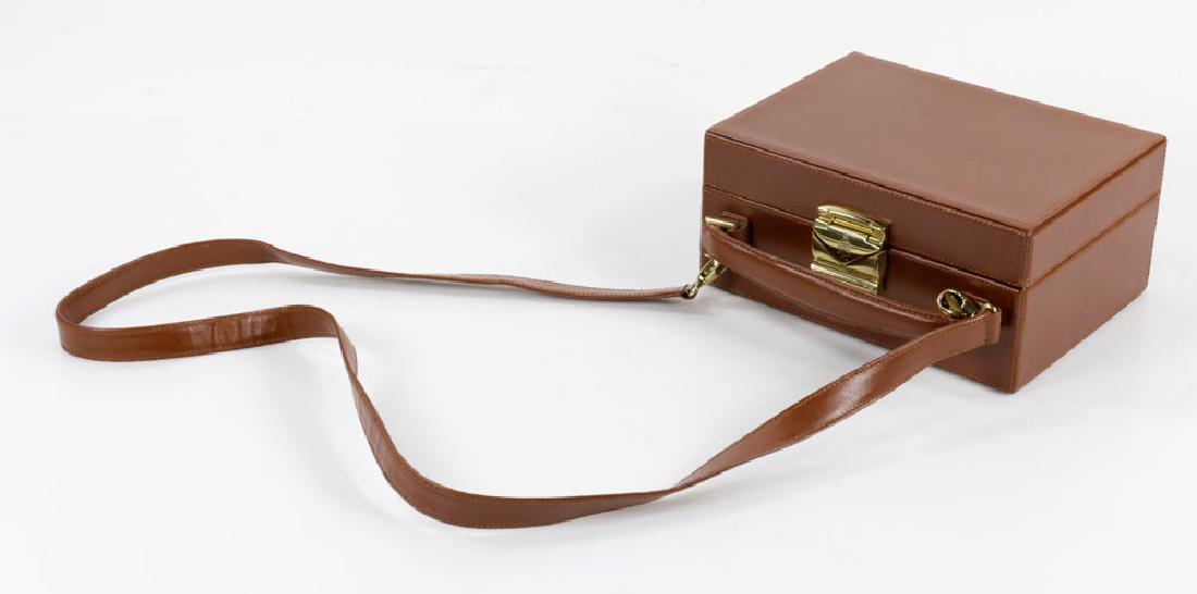 Mark Cross Box Bag: Mark cross brown box bag, 8" h x 8 1/4" w, 28" h (including strap). Provenance: From a Palm Beach estate.The absence of a condition report is not an implication that the lot is in perfect condition or