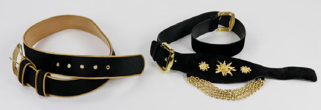 Lot of 2 Escada Suede and Leather Belts: Lot of two Escada belts, to include: black suede belt with sun and chain motif, marked "44"; and fabric blend belt with leather under side, marked "XL 90"; each measuring 40" l. Provenance: From a Pal