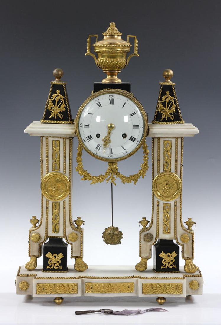 French Empire Style Marble Shelf Clock: French Empire-style shelf clock, 19th century, marble with ormolu gilt mounts, key-wound with pendulum, includes key, 24" h x 16" w x 5 1/2" d. Provenance: From a Beverly Farms, Massachusetts estate.T