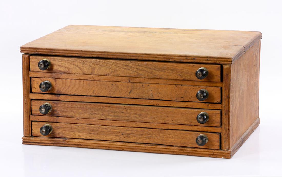 19th C. Pine Spool Cabinet: Pine spool cabinet, late 19th century, with four red velveteen-lined drawers, 9 1/4" h x 20" w x 12 1/2" d. Provenance: From an Andover, Massachusetts estate.The absence of a condition report is not a