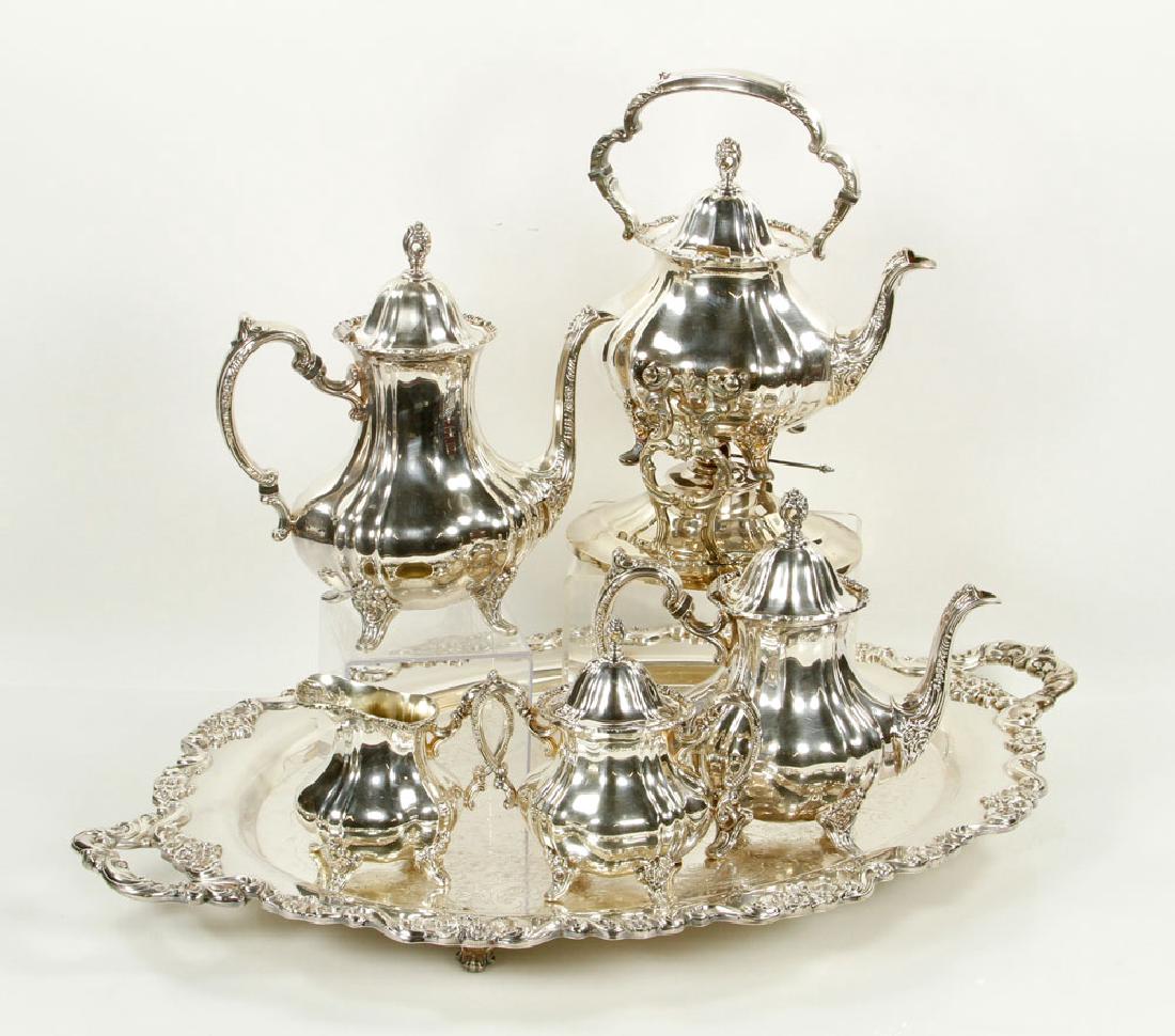 Poole Silver Plate Tea Set: Poole silver plate six piece tea set, in "Lancaster Rose" pattern, to include: coffee pot (11 1/2" h), teapot (10" h), hot water pot on stand (14" h), creamer (5 1/4" h), covered sugar (7 3/4" h) and 