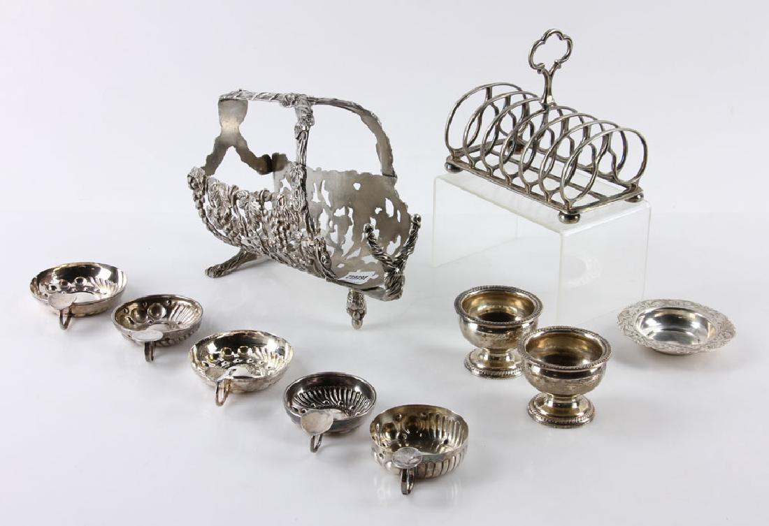 Lot of Silver Plate Items: Lot of silver plate items, to include: wine bottle holder decorated with grape motif, five tastevin cups, toast rack and coaster. Provenance: From a Santa Barbara, California estate. The absence of a