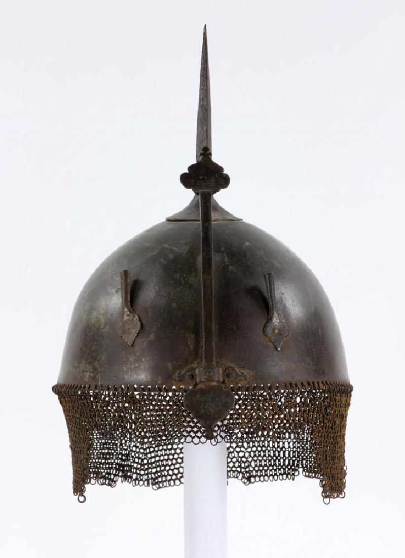 Early Iron Indo-Persian (Kulah Khud) Helmet: Early Indo-Persian iron (kulah khud) helmet, 10" h (excluding chainmail fringe) x 8 1/4" dia. Provenance: From a Boston, Massachusetts estate.