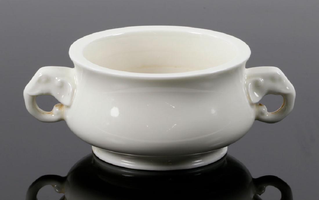 Chinese Blanc-de-Chine Censer: Chinese blanc-de-chine censer, porcelain, round shape with two elephant head handles, 3" high x 7 1/2" diameter.