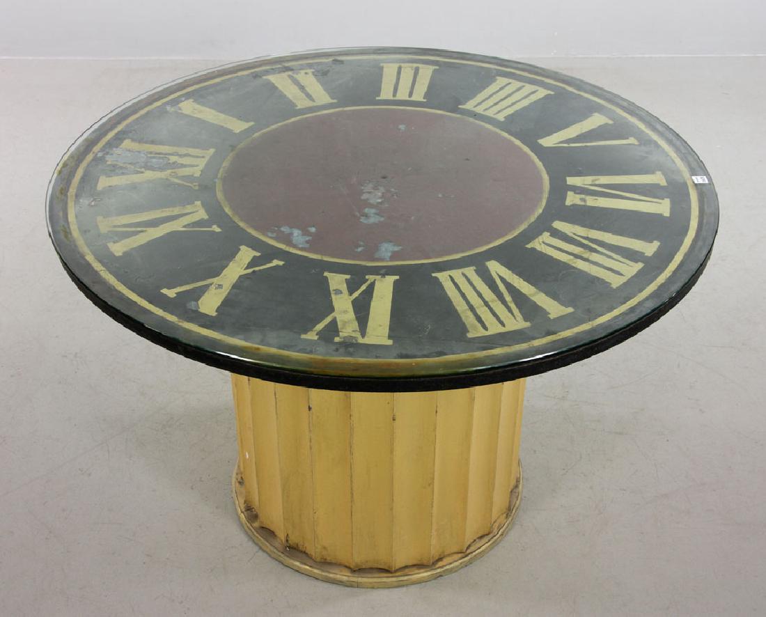 Decorative Clock Face Dining Table: Circular clock face decorated dining table, having original painted tin and gold leaf dial top with glass cover, 30 1/2" high x 48" diameter. Provenance: from a Florida estate.