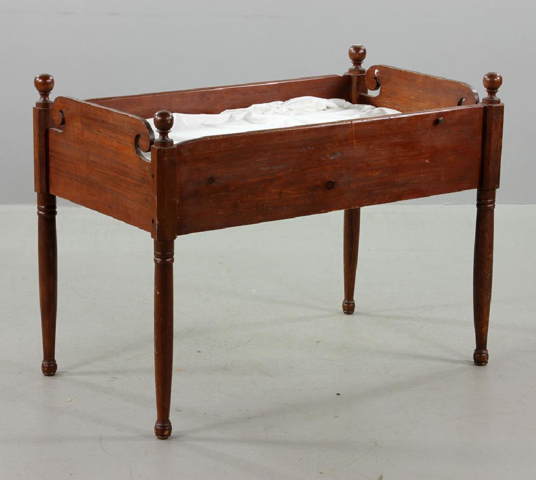 Early 20th C. Child's Bed or Crib: Early 20th century child's bed or crib, oak, on long tapering legs, with mattress, 34" h x 44" w x 26" d.