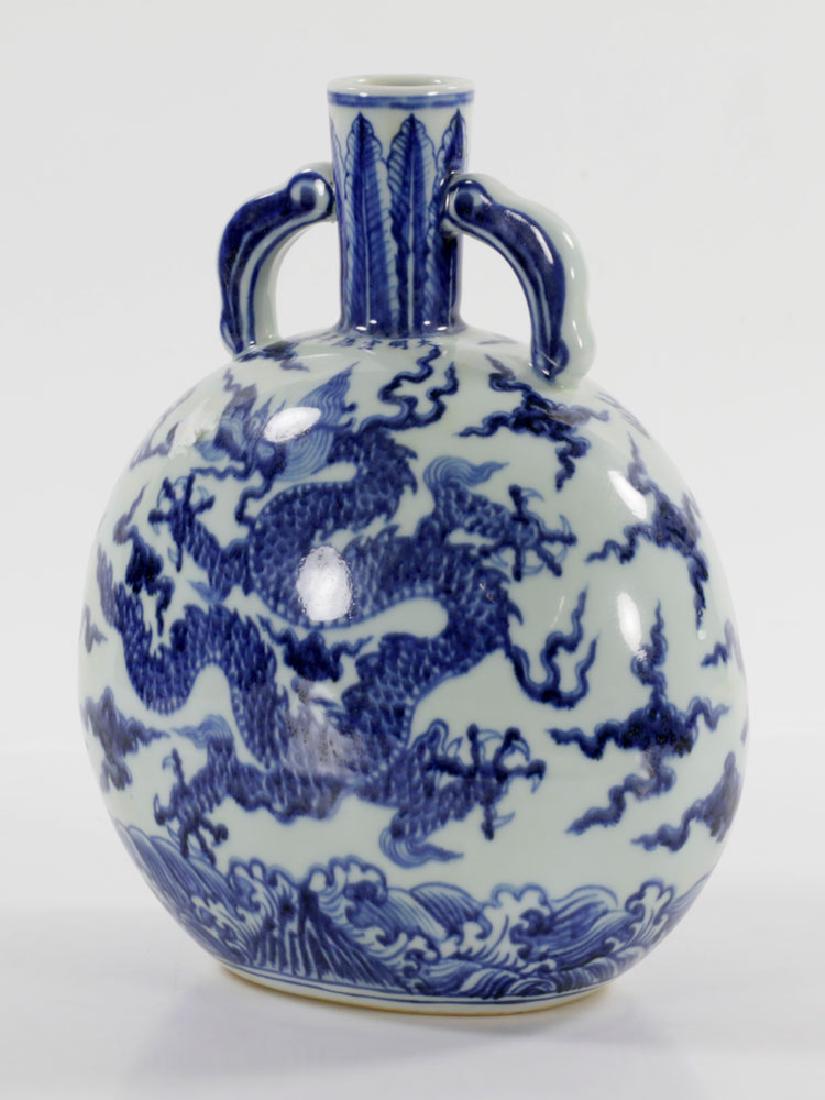 Chinese Blue and White Dragon Flask Vase: Chinese blue and white flask vase, decorated with coiled dragons, Xuande mark below neck, 10 3/4" h x 9" w. Provenance: From a Winchester, Massachusetts collection.