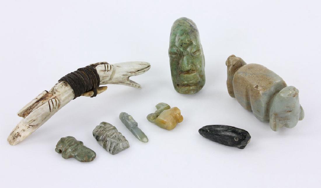 Archive of Pre-Columbian Carvings: Collection of eight pre-Columbian artifacts, to include: seven carvings, jade and hardstone, 3 1/4" high (largest); carving, bone, with rawhide cord and arrowhead, 5 5/8" long. Provenance: from the co