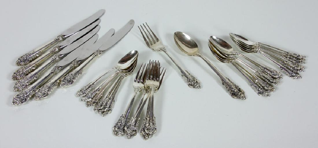 Wallace Sterling Silver "Grande Baroque" Partial: Wallace sterling silver partial flatware set, "Grande Baroque" pattern, to include: 6 9 3/4" dinner knives, 7 6 1/2" forks, 13 6 3/4" spoons, 6 6" spoons, 1 8 5/8" serving spoon, 1 8 1/8" serving fork