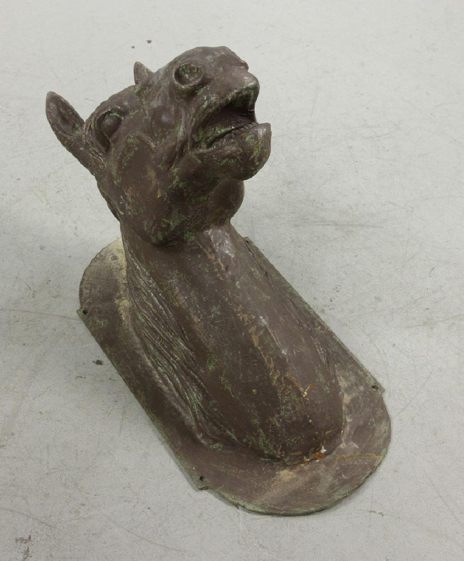 Cast Iron Equestrian Wall Mounts: Cast iron equestrian wall mounts, in the shape of horse heads, 22" h x 30" w x 13" d.