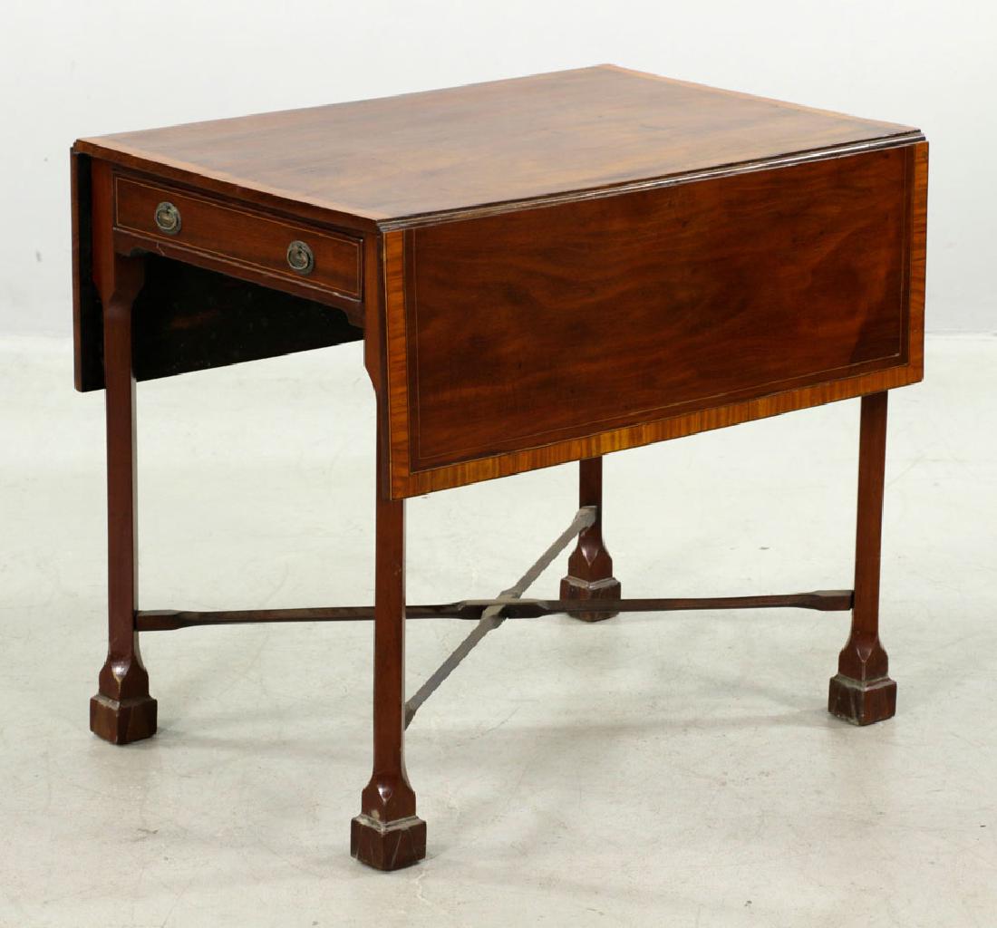 English Mahogany Pembroke Table: English sugar-island mahogany Thomas Chippendale inspired Pembroke table with highly unusual Marlboro feet under strangely mounted off-center legs with stretchers, crossbanded top, and drawer. 30" x 3