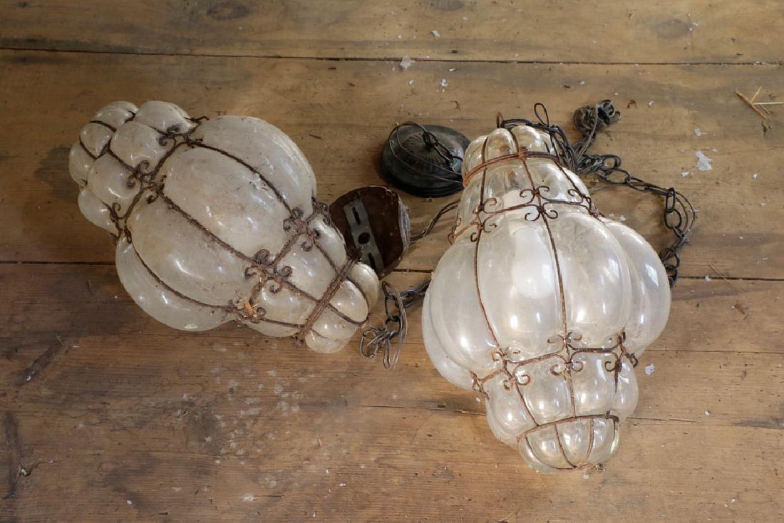 Pr of Venetian Wrought Iron Hanging Light Fixtures: Pair of Venetian wrought iron and glass hanging light fixtures, 15 1/2" x 10".