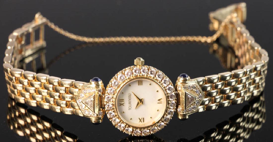 Ladies' 14k Yellow Gold and Diamond Watch: Ladies' 14k yellow gold and diamond Toureau watch, 7 1/2" l., 7/8" face diameter, approximately 2.0 CTW of diamonds, approximately 53 grams TW (including movement).