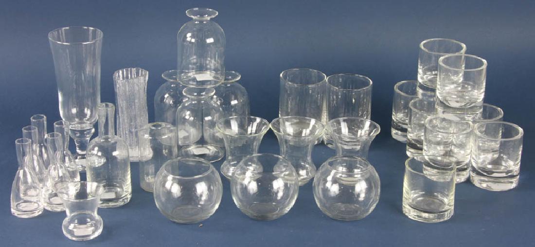 Group of Glass Vases: Group of (33) glass vases, ranging in size from 3" H to 9" H. Provenance: Studio Props of Martha Stewart.