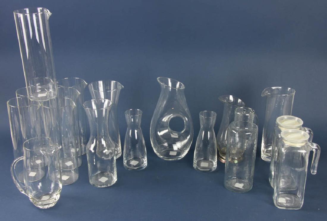 Collection of Glass Carafes: Collection of colorless glass wine carafes and pitchers, 18 in total, tallest stands 11 3/4" H. Provenance: Studio Props of Martha Stewart.