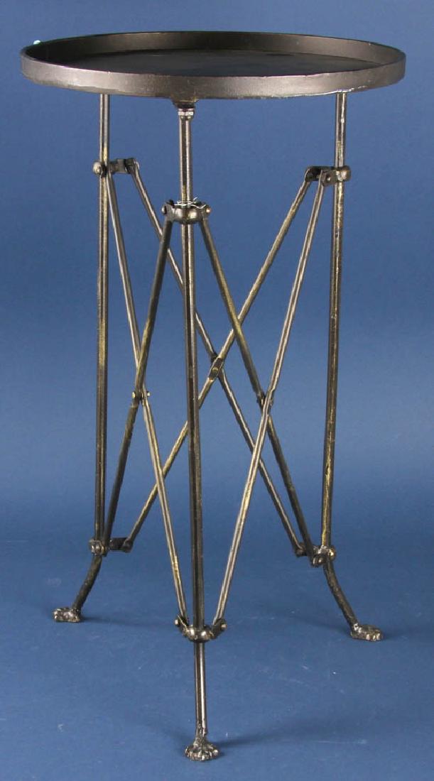 Wrought Iron Plant Stand: Wrought iron adjustable plant stand, 25 3/4" H x 14 1/4" in diameter. Provenance: Studio Props of Martha Stewart.