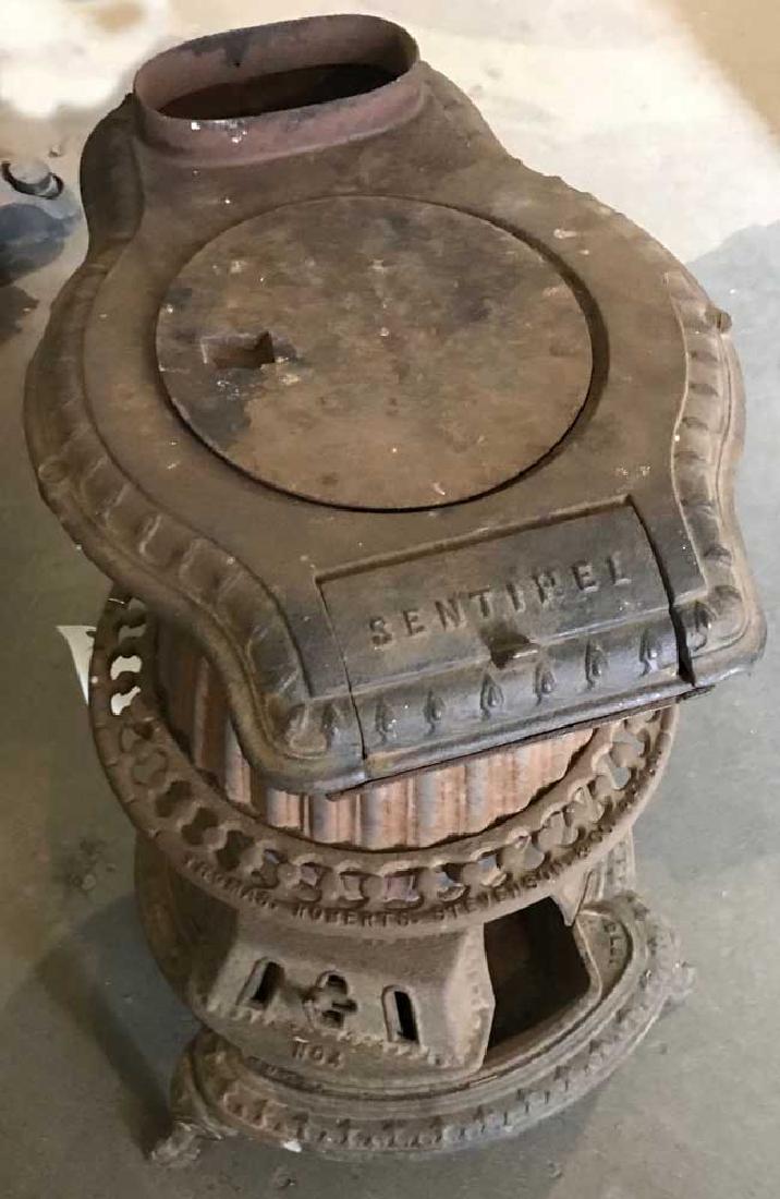 Antique Sentinel Cast Iron Stove: Antique Sentinel cast iron stove, 29" H x 19". Provenance: A Massachusetts collection.