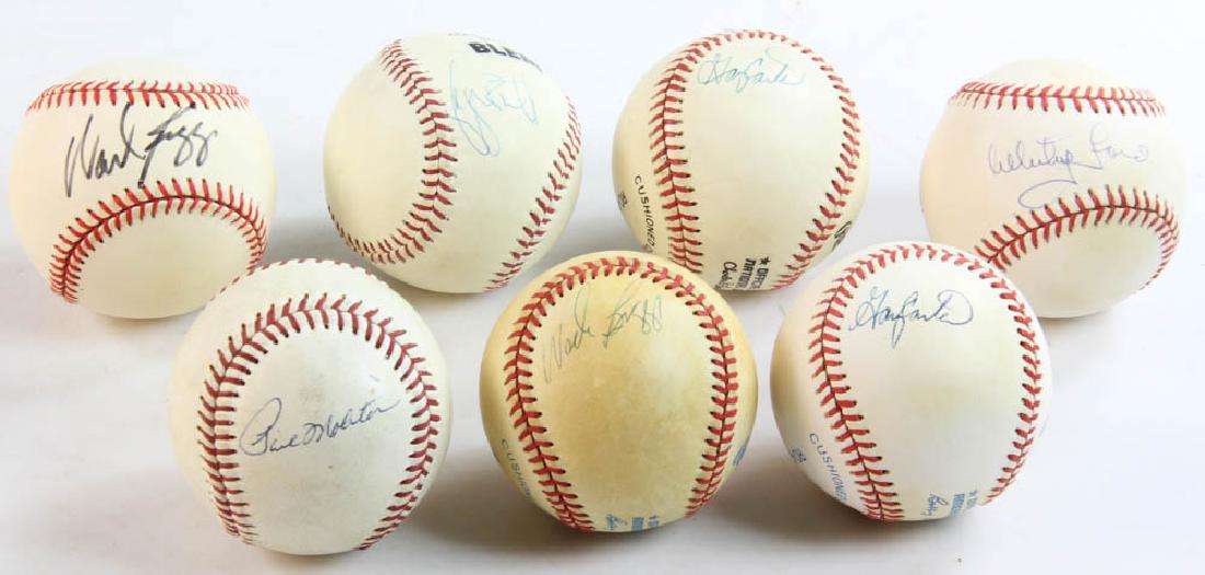 Seven Autographed HOF Baseballs: Collection of seven (7) autographed baseballs by Hall of Fame players to include Whitey Ford, two by Wade Boggs, George Brett, Paul Molitor and two by Gary Carter.