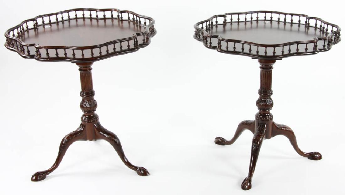 Pair of George III Style Tilt Top Tables: Pair of George III-style carved mahogany tilt-top tables, balustrade gallery, ball-and-claw feet.