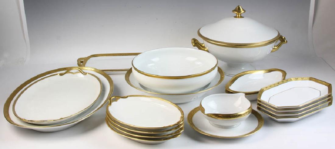 Collection of Limoges Gold Rimmed China: Collection of Limoges china, white with gold rims, various companies and patterns, serving pieces to include covered bowls, platters, trays, etc., largest covered bowl measures 9 1/2" H x 12 1/2" hand